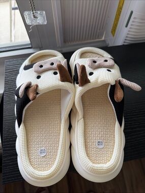 Cream and Black Cow Slip-On Shoes